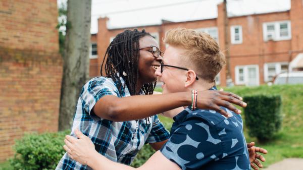 YouTuber Tyler Oakley and Sharifa hugging